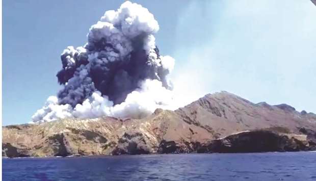 Smoke from the volcanic eruption of Whakaari, also known as White Island, is pictured from a boat, New Zealand in this picture grab obtained from a social media video.