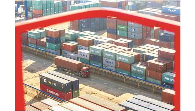 A truck drives past shipping containers at a port in Lianyungang, Jiangsu province. China is in preliminary talks to support the European Unionu2019s backup plan for settling international trade disputes as US President Donald Trumpu2019s administration gets closer to scuttling the World Trade Organisationu2019s role in refereeing cross-border commerce.
