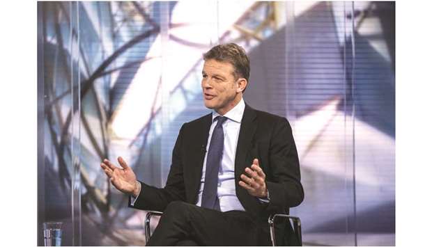 Deutsche Bank CEO Christian Sewing gestures while speaking during a Bloomberg Television interview in Frankfurt yesterday. Sewing is rolling back years of aggressive expansion, when Deutsche Bank sought to compete as a global securities firm, and bolstering controls to avoid a repeat of misconduct charges that eroded its financial strength and reputation alike.