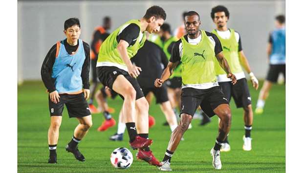 (From left) Al Saddu2019s Nam Tae-hee, Mostafa Tarek, Abdelkarim Hassan and Akram Afif take part in a training session ahead of the start of the FIFA Club World Cup Qatar 2019 in Doha. PICTURES: Noushad Thekkayil