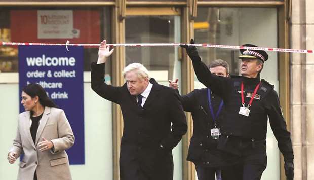 Prime Minister Johnson, Home Secretary Priti Patel, and Commissioner of the City of London Police Ian Dyson arrive at the scene of the attack on London Bridge.