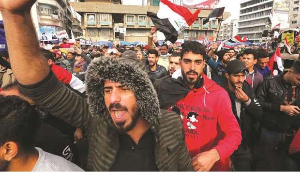 Iraqis gather at Tahrir square in Baghdad amid ongoing anti-government protests, yesterday.