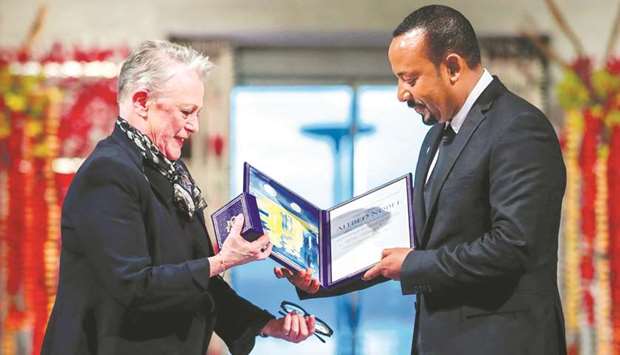 Ethiopian Prime Minister Abiy Ahmed Ali receives medal and diploma from Chair of the Nobel Comitteee Berit Reiss-Andersen during Nobel Peace Prize awarding ceremony in Oslo City Hall, Norway, yesterday.