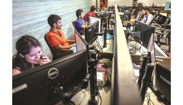 Employees work at an office in Mumbai. Indiau2019s first attempt to regulate data generated by more than 600mn Internet users has raised concerns about mass surveillance.
