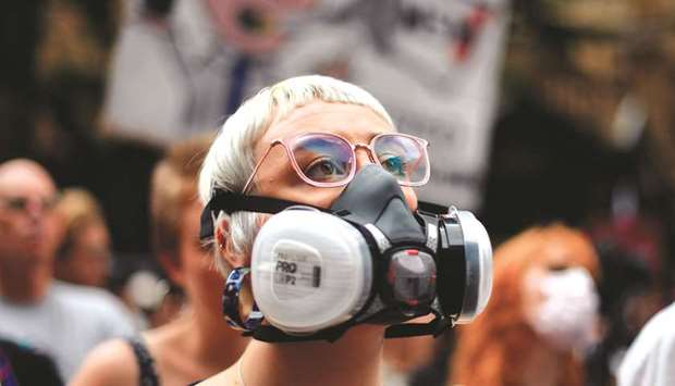 A demonstrator with a gas mask attends a protest rally in Sydney.