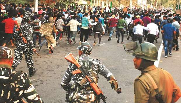 Security personnel disperse students protesting against the governments Citizenship Amendment Bill, in Guwahati yesterday.