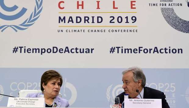 United Nations Secretary-General Antonio Guterres (R) and UN Climate Change Executive Secretary Patricia Espinosa hold a press conference, at the 'IFEMA - Feria de Madrid' exhibition centre, in Madrid