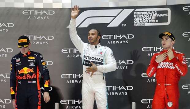 Mercedes' Lewis Hamilton celebrates after winning the race with second placed Red Bull's Max Verstappen and third placed Ferrari's Charles Leclerc