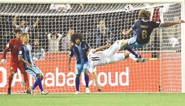 Al Saddu2019s Baghdad Bounedjah (second from right, also inset) in action against Hienghene Sport during the FIFA Club World Cup Qatar 2019 play-off in Doha on Wednesday. PICTURES: Noushad Thekkayil, AFP