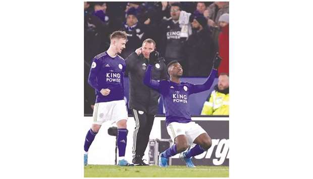 Leicester Cityu2019s Kelechi Iheanacho (right) celebrates after scoring against Everton as teammate James Maddison (left) and manager Brendan Rodgers look on in Leicester yesterday. (Reuters)