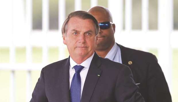 President Jair Bolsonaro leaves the Alvorada Palace in Brasilia, Brazil, yesterday.