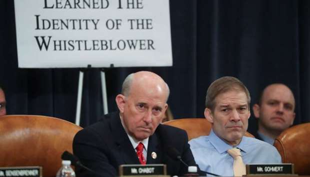 US House Judiciary Committee Republican members Rep. Louie Gohmert (R-TX) and Rep. Jim Jordan (R-OH) watch as the committee votes to approve articles of impeachment against U.S. President Donald Trump and send them on the full House of Representatives on Capitol Hill in Washington