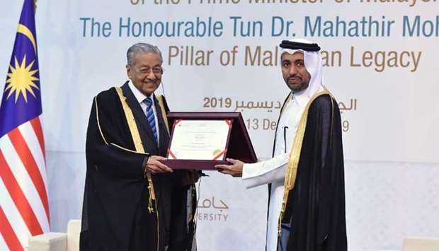 Malaysian Prime Minister Dr Mahathir bin Mohamed receives honorary doctorate from Qatar University president Dr Hassan al-Derham