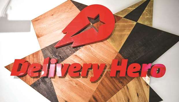 The logo of online food ordering and delivery giant Delivery Hero is seen at its global headquarters in Berlin. The German takeaway giant said it had agreed to buy South Koreau2019s largest food delivery app Woowa in a $4bn deal aimed at beefing up its presence in Asia.
