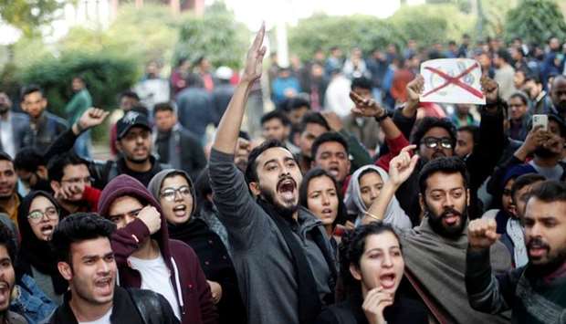 Protesters shout slogans during a protest against the Citizenship Amendment Bill, that seeks to give citizenship to religious minorities persecuted in neighbouring Muslim countries, inside the Jamia Millia Islamia University in New Delhi, India