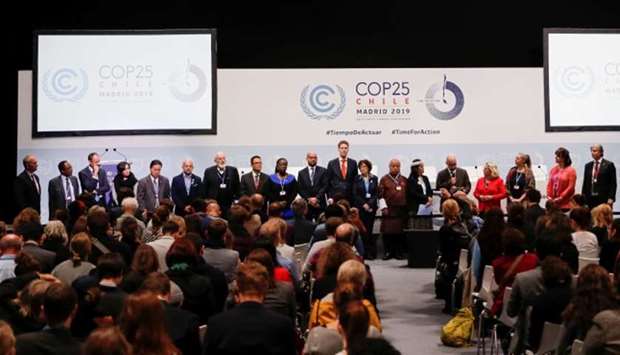 EU Executive Vice-President in charge of the European Green Deal, Frans Timmermans poses with ministers and envoys from the High Ambition Coalition during the UN Climate Change Conference (COP25) in Madrid, Spain