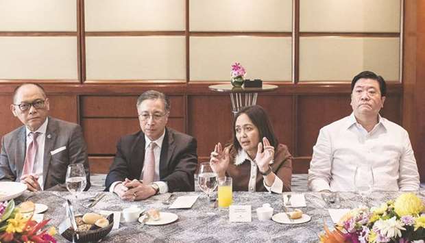 Chuchi Fonacier, deputy governor of the Bangko Sentral ng Pilipinas (centre right), speaks as (from left) Benjamin Diokno, governor of the BSP; Nestor Tan, president of BDO Unibank Inc, and Fabian Dee, president of Metropolitan Bank and Trust Co, listen during a Bloomberg round table event in Manila. Diokno said the central bank has now paused its easing u201cbecause we want to find out how the 75 basis points that we did this year, and 400 basis point cut in the reserve requirement, is going through the system.u201d