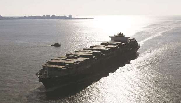 A container ship sails into New York Harbour in New York (file). The new IMO 2020 rules will curb use of traditional ship fuel, or bunkers, and stoke demand for more complex blended products.