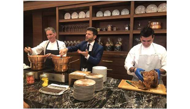 SPECIAL CAKE: Pasquale Salzano, Ambassador of Italy to Qatar, served pieces of the Italian delicacy panettone cake among the guests.