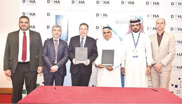 QCRI and UNDP officials at the signing ceremony.