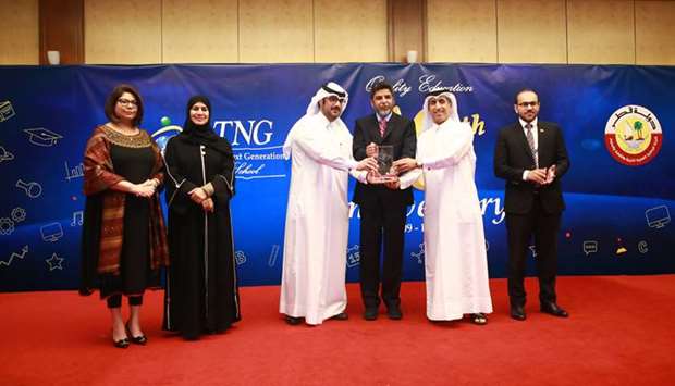 Ammar al-Mashhadani, Head of Public Relations Department, receiving the award on behalf of Qatar Cancer Society.