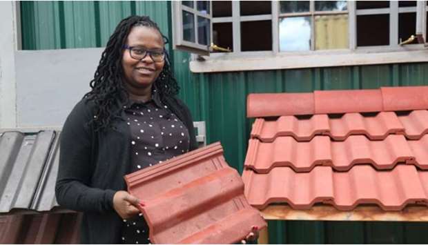 Hope Mwanake, co-founder of Eco Blocks and Tiles, poses for a photo at her factory in Gilgil, Kenya.
