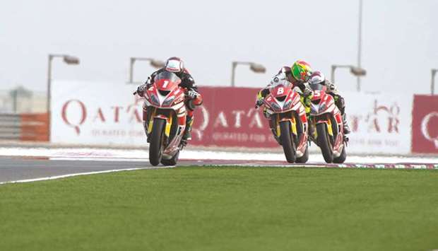 Abdulla al-Qubaisi, Saeed al-Sulaiti and Mashel al-Naimi in action  during the the opening round of the Qatar Superstock 600 Championship at the Losail International Circuit.