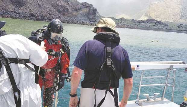 Members of a dive squad conduct a search during a recovery operation around White Island, a volcanic island that fatally erupted earlier this week, in New Zealand yesterday.