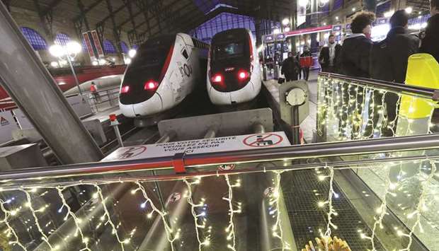 TGV trains are pictured behind Christmas decorations at Gare du Nord train station during a strike over pension reforms.