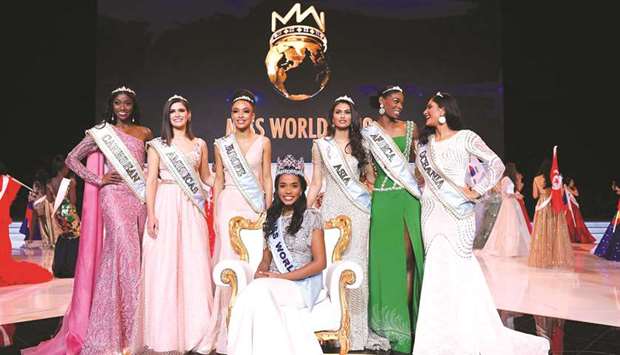 Newly-crowned Miss World 2019 Miss Jamaica Toni-Ann Singh smiles as she poses with her crown during the Miss World Final 2019 at the Excel arena in east London.