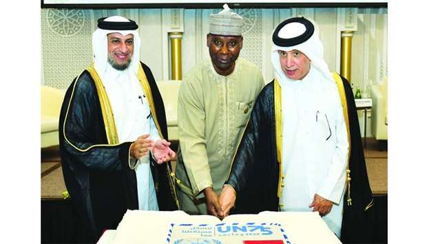 HE the Minister of State for Foreign Affairs Sultan bin Saad al-Muraikhi and the UN General Assembly president Tijani Mohamed Bande cut a cake on the occasion as UN Secretary General's special adviser Dr Ahmed al-Meraikhi looks on. PICTURES: Ram Chand