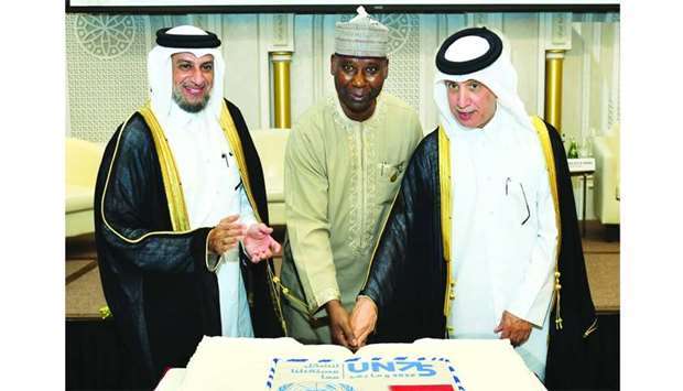HE the Minister of State for Foreign Affairs Sultan bin Saad al-Muraikhi and the UN General Assembly president Tijani Mohamed Bande cut a cake on the occasion as UN Secretary General's special adviser Dr Ahmed al-Meraikhi looks on. PICTURES: Ram Chand