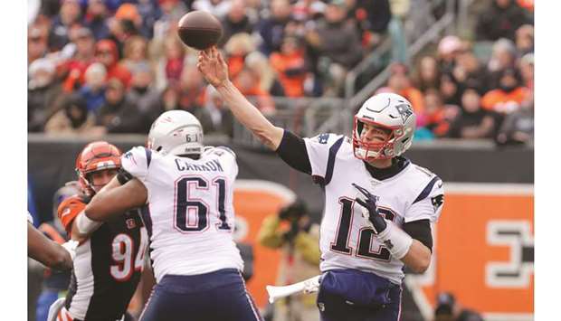 New England Patriotsu2019 quarterback Tom Brady (right) throws a pass against the Cincinnati Bengals during the first half at Paul Brown Stadium. PICTURE: USA TODAY Sports