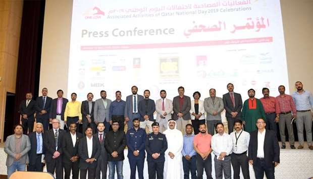 Ministry of Interior officials along with representatives of various expatriate communities pose for a group photo after a press conference.