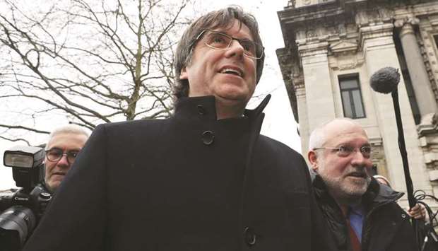 Former Catalan leader Carles Puigdemont and former Catalan regional minister Lluis Puig arrive at the Justice Palace in Brussels, Belgium.