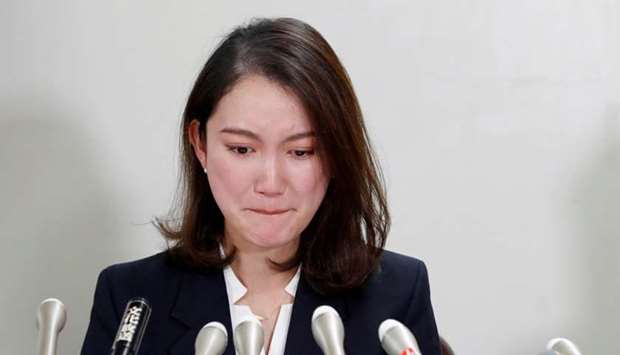 Japanese freelance journalist Shiori Ito reacts during her news conference after a court verdict in Tokyo, Japan