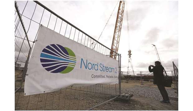 The Nord Stream 2 logo sits on a banner as construction continues at the gas pipeline landing site, operated by Gazprom, in Lubmin, Germany (file). Nord Stream 2 is being laid on the  bottom of the Baltic Sea to feed gas from Russia into Germany.