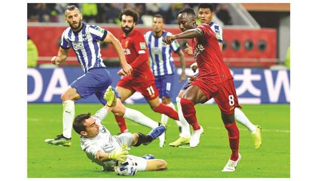 Liverpoolu2019s Naby Keita (right) is closed down by Monterrey goalkeeper Marcelo Barovero during the FIFA Club World Cup semi-final at the Khalifa International Stadium in Doha yesterday.
