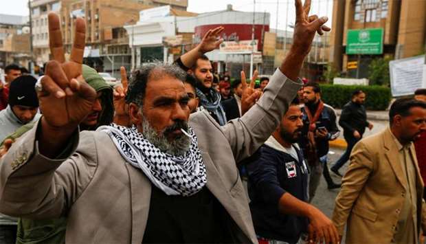 An Iraqi demonstrator reacts during ongoing anti-government protests in Najaf