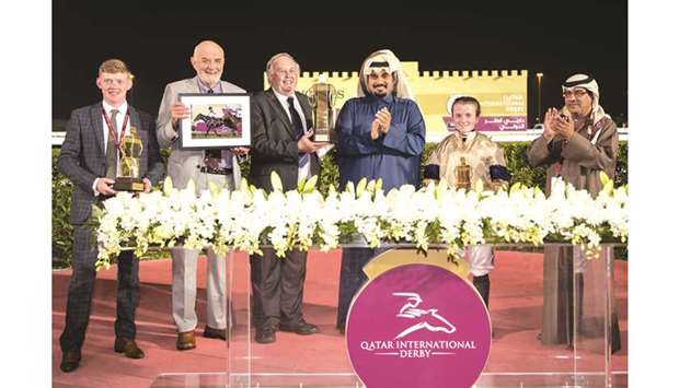 QREC CEO Nasser Sherida al-Kaabi (third from right) with the winners of Al Rayyan Stakes after Hollie Doyle (second from right) rode Maystar to victory yesterday.
