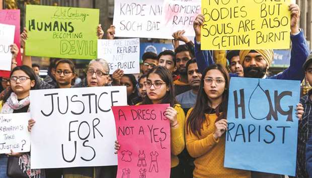 Students and social workers hold placards during a protest in Amritsar yesterday seeking justice in the Hyderabad rape case.