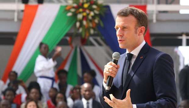 French President Emmanuel Macron delivers a speech during the inauguration of the ,WinWin, Agora-Koumassi social-cultural sports centre in the Koumassi quarter of Abidjan