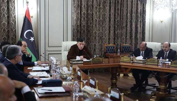 Libya's UN-recognised Prime Minister Fayez al-Sarraj (C) holds a cabinet meeting in the Libyan capital Tripoli Thursday