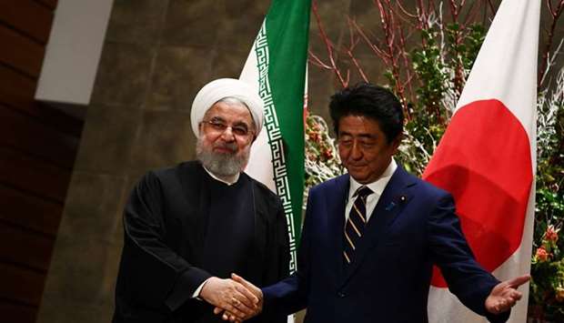 Japanese Prime Minister Shinzo Abe and Iranian President Hassan Rouhani meet in Tokyo, Japan, yesterday.
