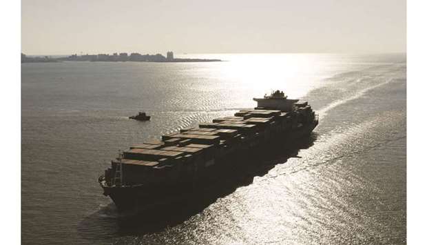 A container ship sails into the New York Harbor (file). In fewer than two weeks, thousands of ships the world over will be forced to use fuel containing less sulphur in order to comply with global rules set out by the International Maritime Organization. Those who donu2019t could face penalties and even imprisonment. Ports are deploying drones to u2013 literally u2013 sniff out wrongdoers. The regulations are having a profound effect on oil refineries and the cost of seaborne trade looks set to rise.
