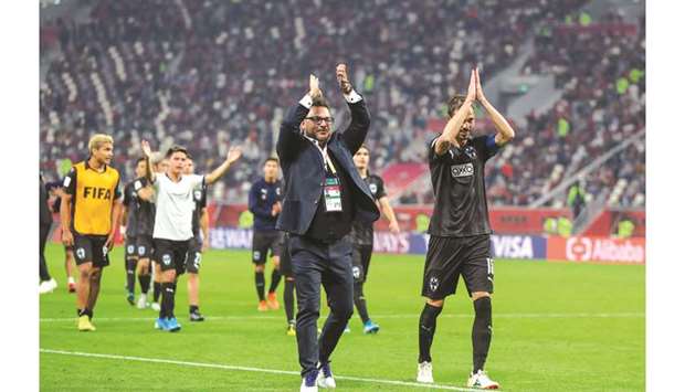 Monterrey coach Antonio Mohamed (C) and players greet fans after the 2019 FIFA Club World Cup 3rd place playoff against Saudi Arabiau2019s Al Hilal at the Khalifa International Stadium yesterday. Picture on right shows Monterrey goalkeeper Luis Cardenas celebrating his goal in the penalty shootout.