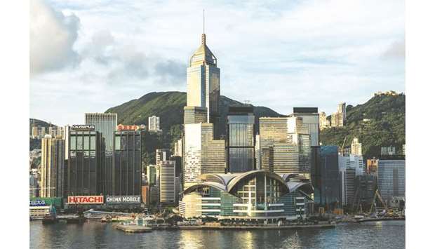 The Hong Kong Convention and Exhibition Centre and other commercial and residential buildings standing on Hong Kong island are seen from the Tsim Sha Tsui district. Hong Kongu2019s retail sales suffered a record contraction in October, as the city counts the cost of almost six months of political unrest.