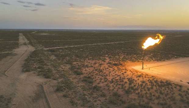 A gas flare burns at dusk in the Permian Basin in Texas (file). Opec members believe relentless US oil production growth will slow rapidly next year.