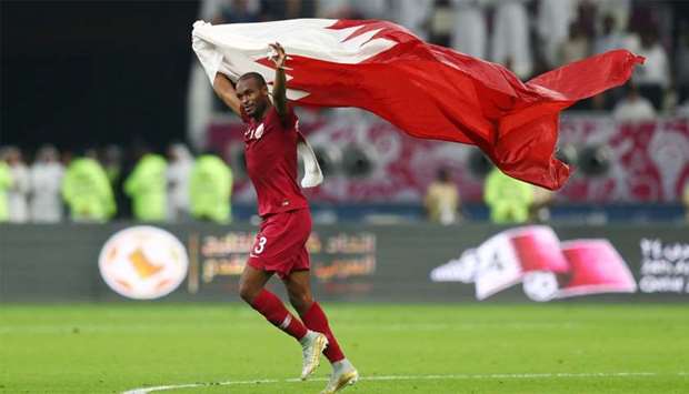 Qatar's Abdelkarim Hassan celebrates after the match