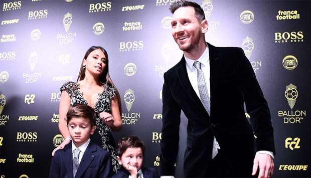Barcelona's Argentinian forward Lionel Messi (R) and his wife Antonella Roccuzzo (L) and their sons Thiago and Mateo attend the Ballon d'Or France Football 2019 ceremony